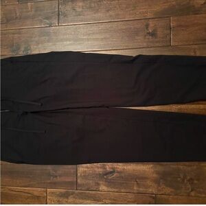 Black slack pants with drawstrings to tighten waist